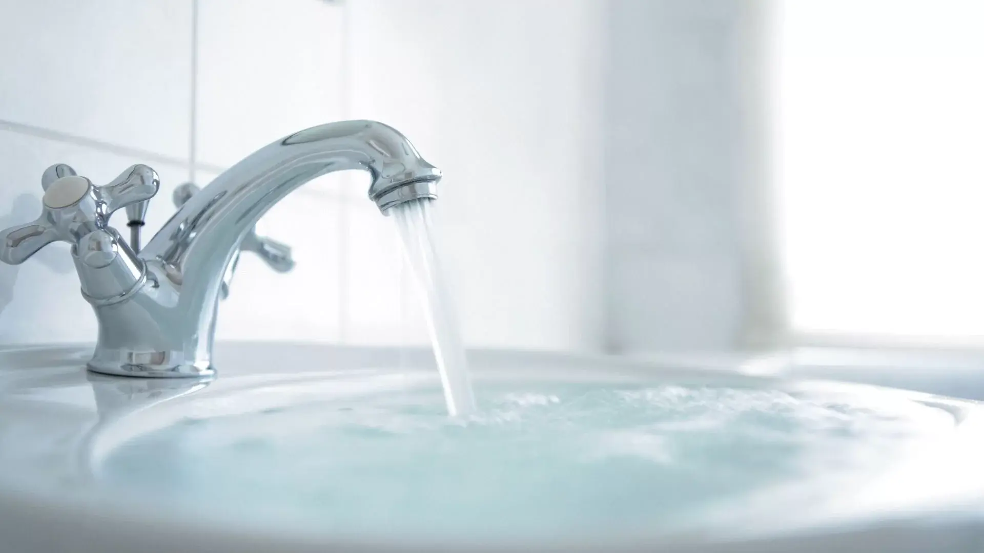 water-pouring-into-overflowing-sink-from-tap